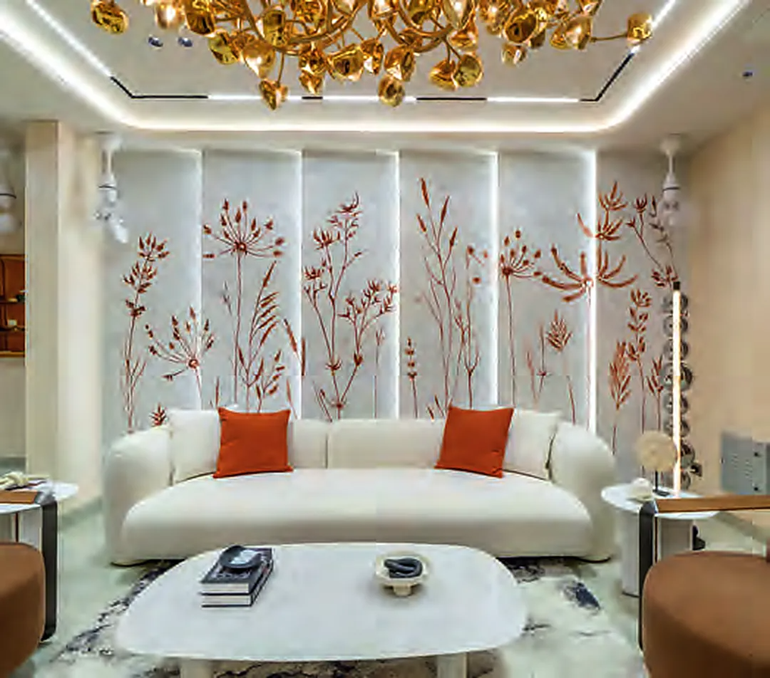 Living area of the Diamond Towers model apartment with a hand-painted feature wall and sculptural lighting